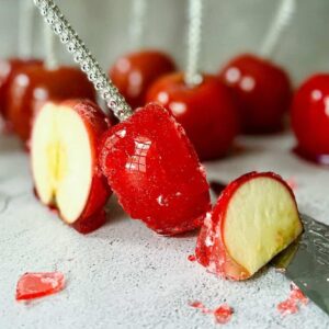 candied apples on skewers sliced into pieces