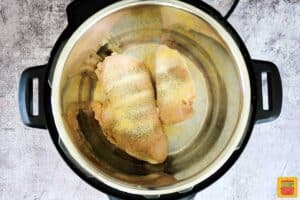 chicken with seasoning in an instant pot