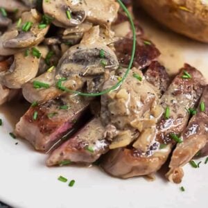 sliced steak diane on a plate