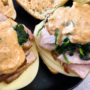 two philly pork sandwiches up close with remoulade sauce