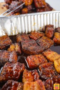 pork belly burnt ends in a metal disposable pan