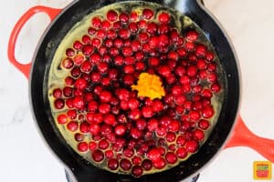 cranberries and orange zest in a sauce pan