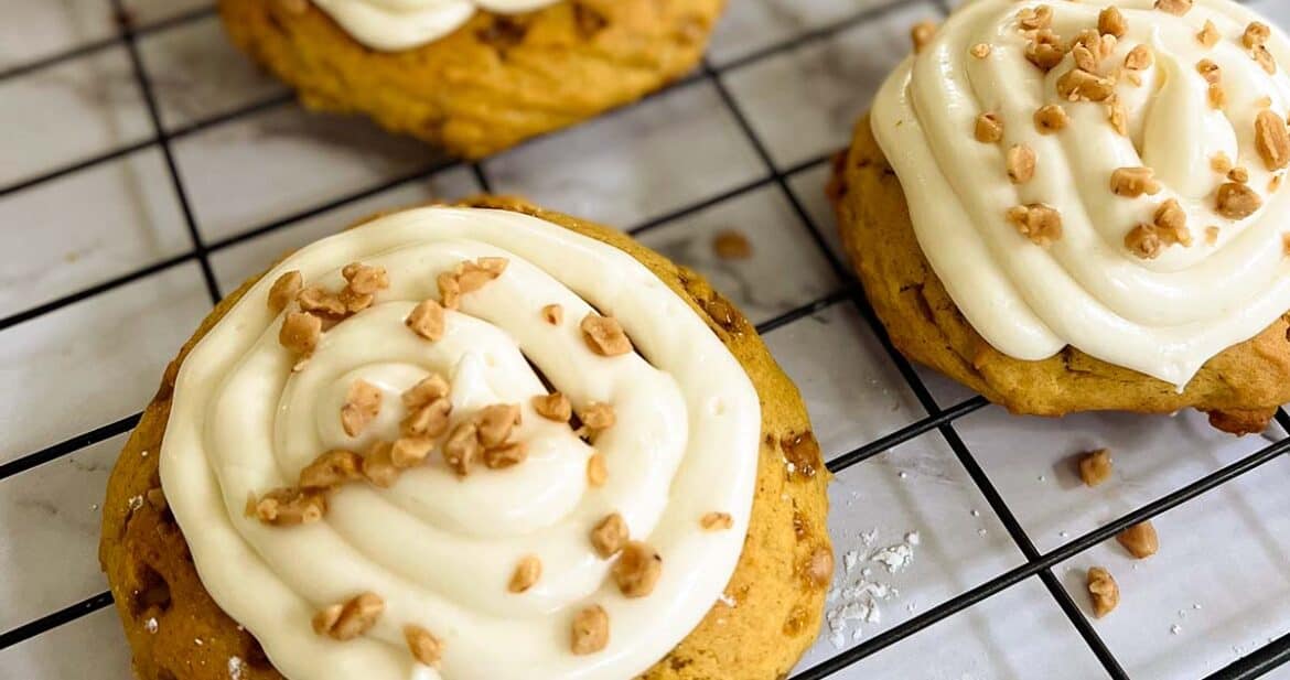 pumpkin pie cookies with cream cheese frosting on a cookie tray