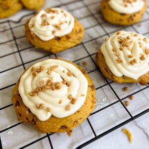 pumpkin pie cookies with cream cheese frosting on a cookie tray