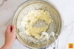 butter and sugar whisked together in a bowl