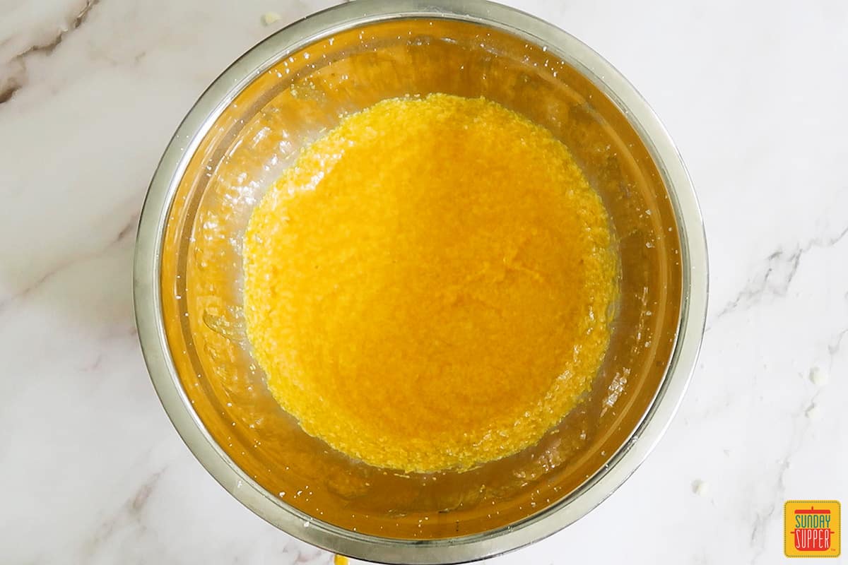 pumpkin puree and eggs mixed in bowl