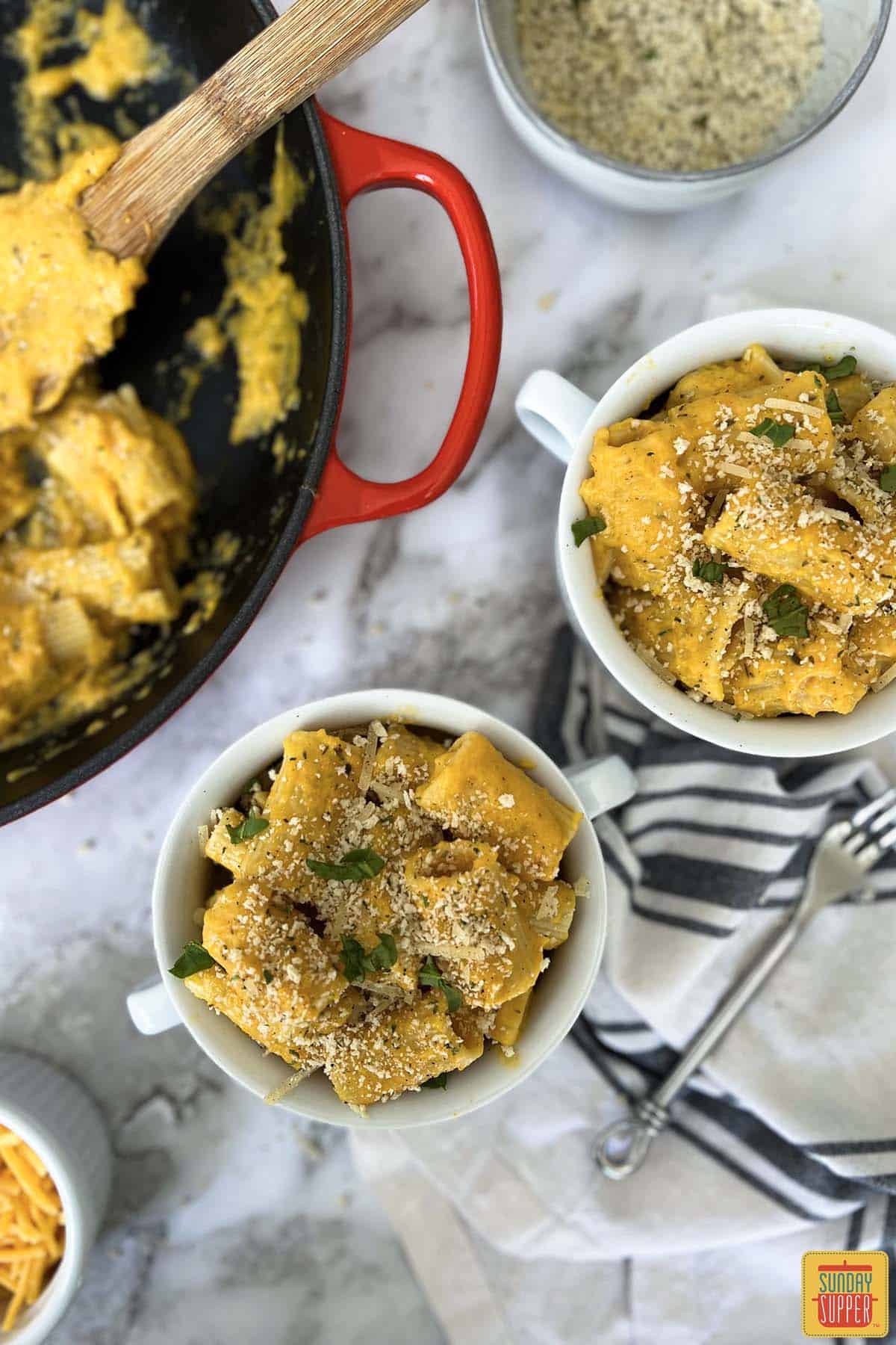 two white bowls of butternut squash mac and cheese
