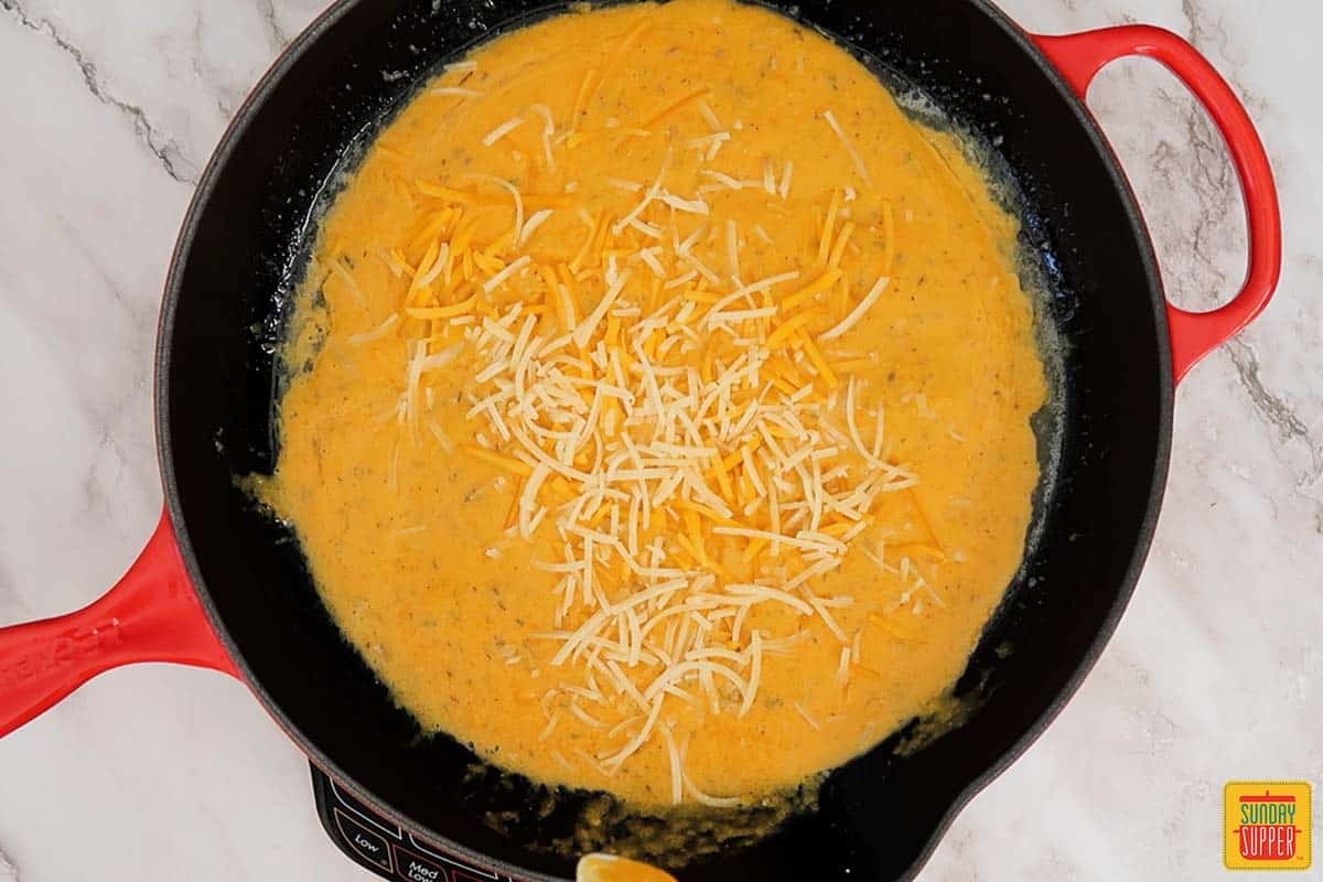 adding cheese to butternut squash mixture