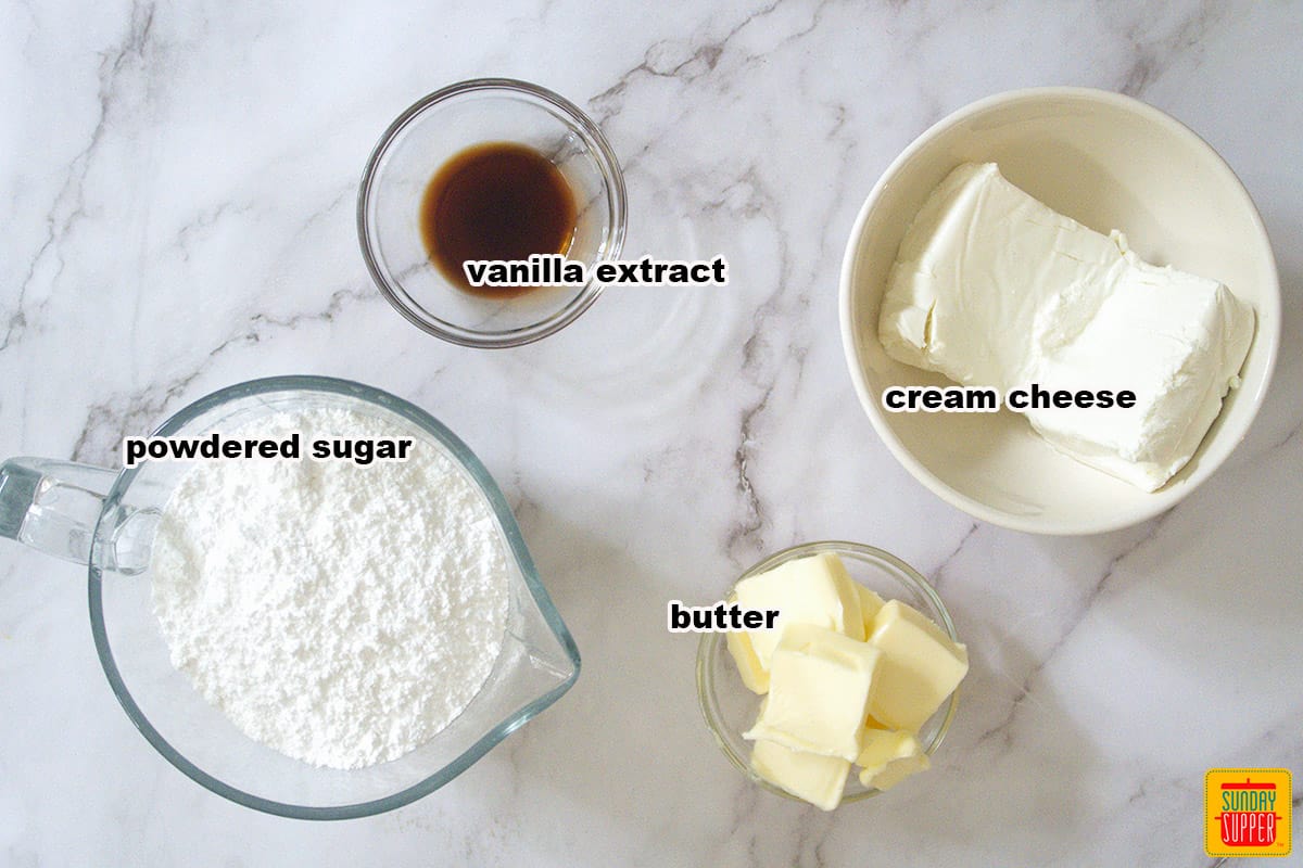 ingredients for cream cheese frosting recipe laid out on the table