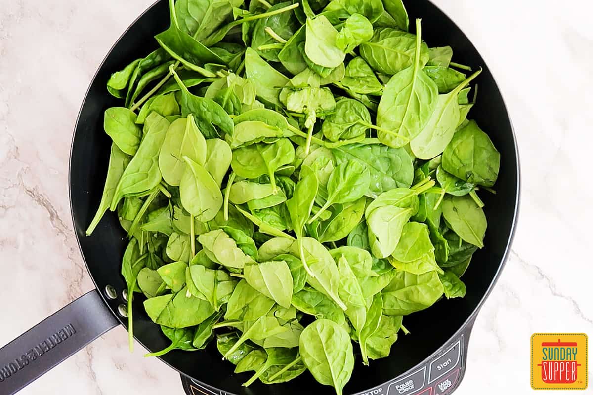spinach in a black skillet