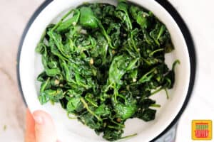 sautéed spinach in a white bowl