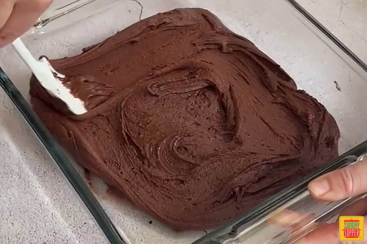 brownie mix at the bottom of a baking dish