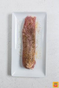 pork tenderloin seasoned on platter