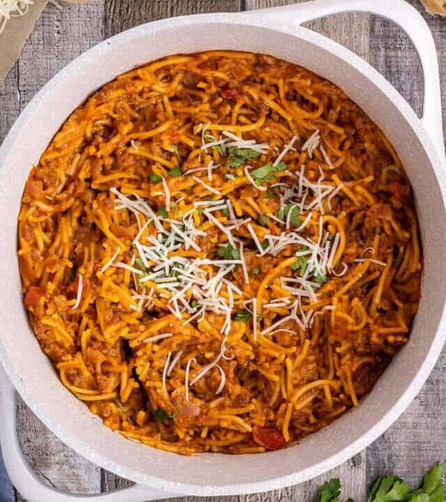 topping one pot spaghetti in pot with cheese