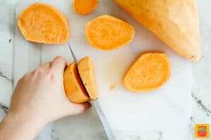 chopping a sweet potato