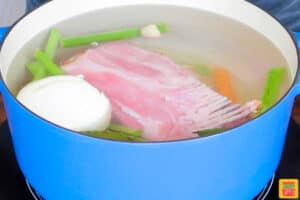 a pot of water and ham stock ingredients