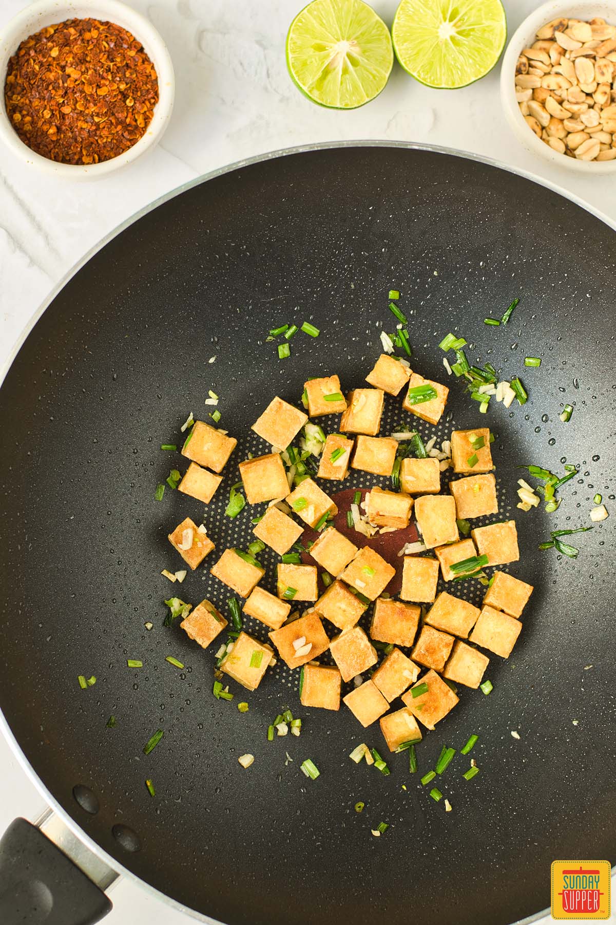 tofu browned in a wok with seasoning
