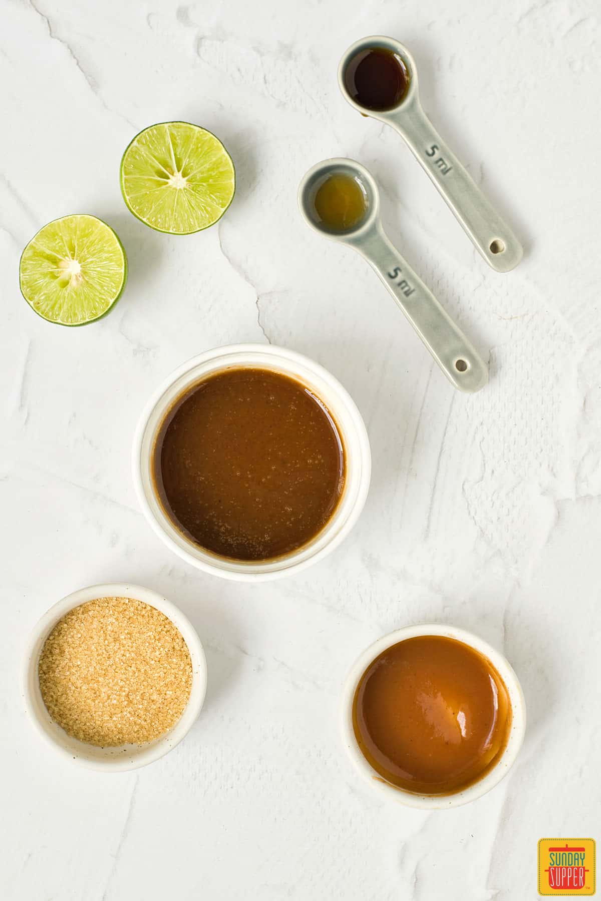 pad thai sauce ingredients in bowls and measuring spoons