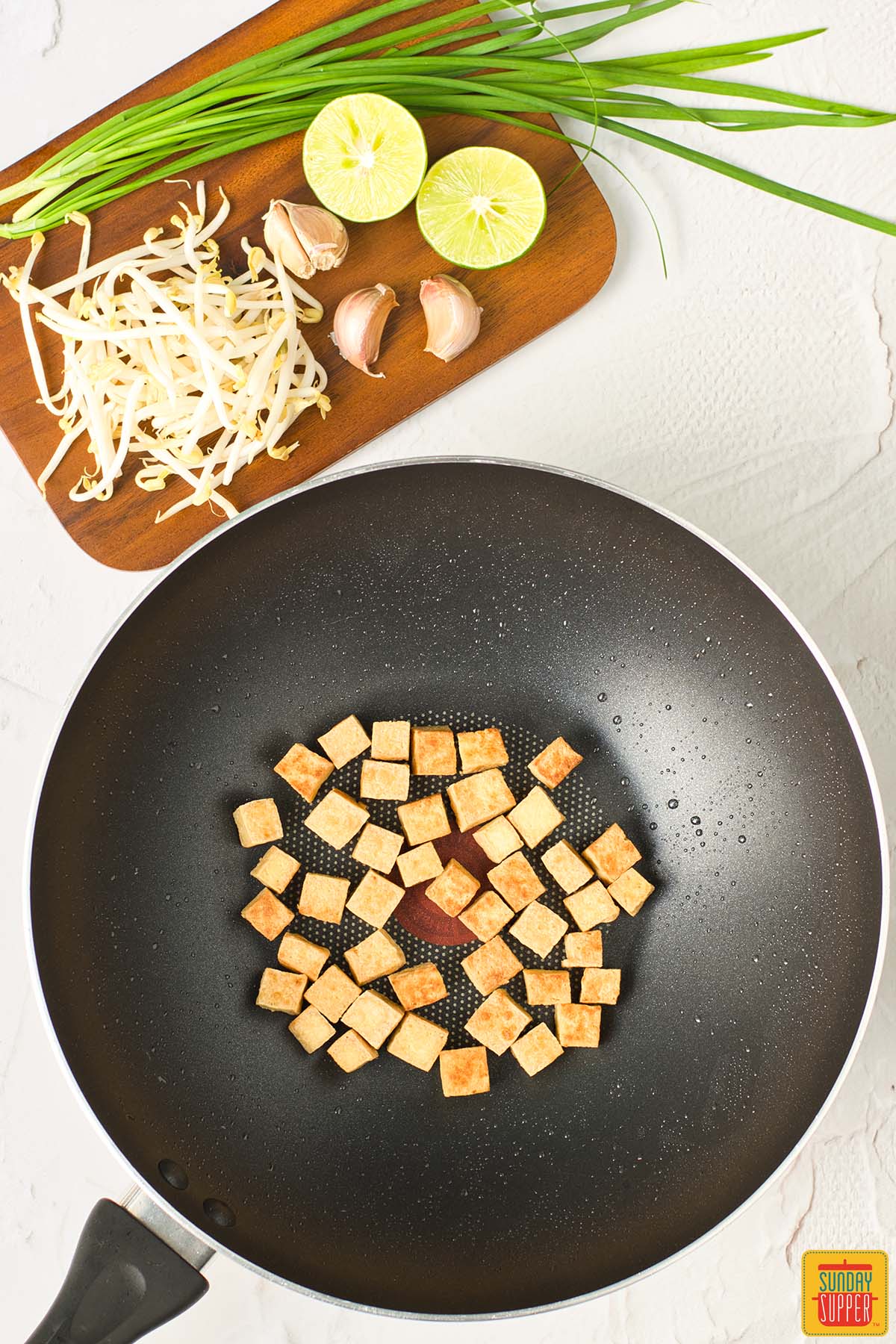 browned tofu in a wok