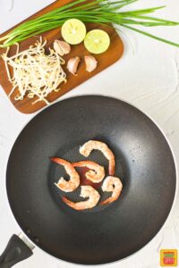 cooked shrimp in a wok