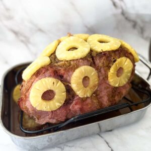 ham with pineapple rings on roasting rack