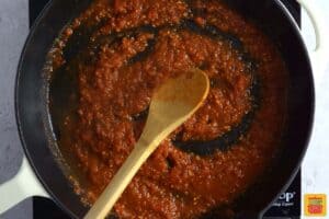 stirring salsa in a pan