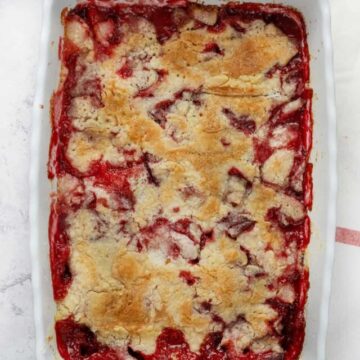 strawberry dump cake baked in a white dish