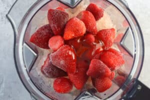 adding ingredients for frose to a blender