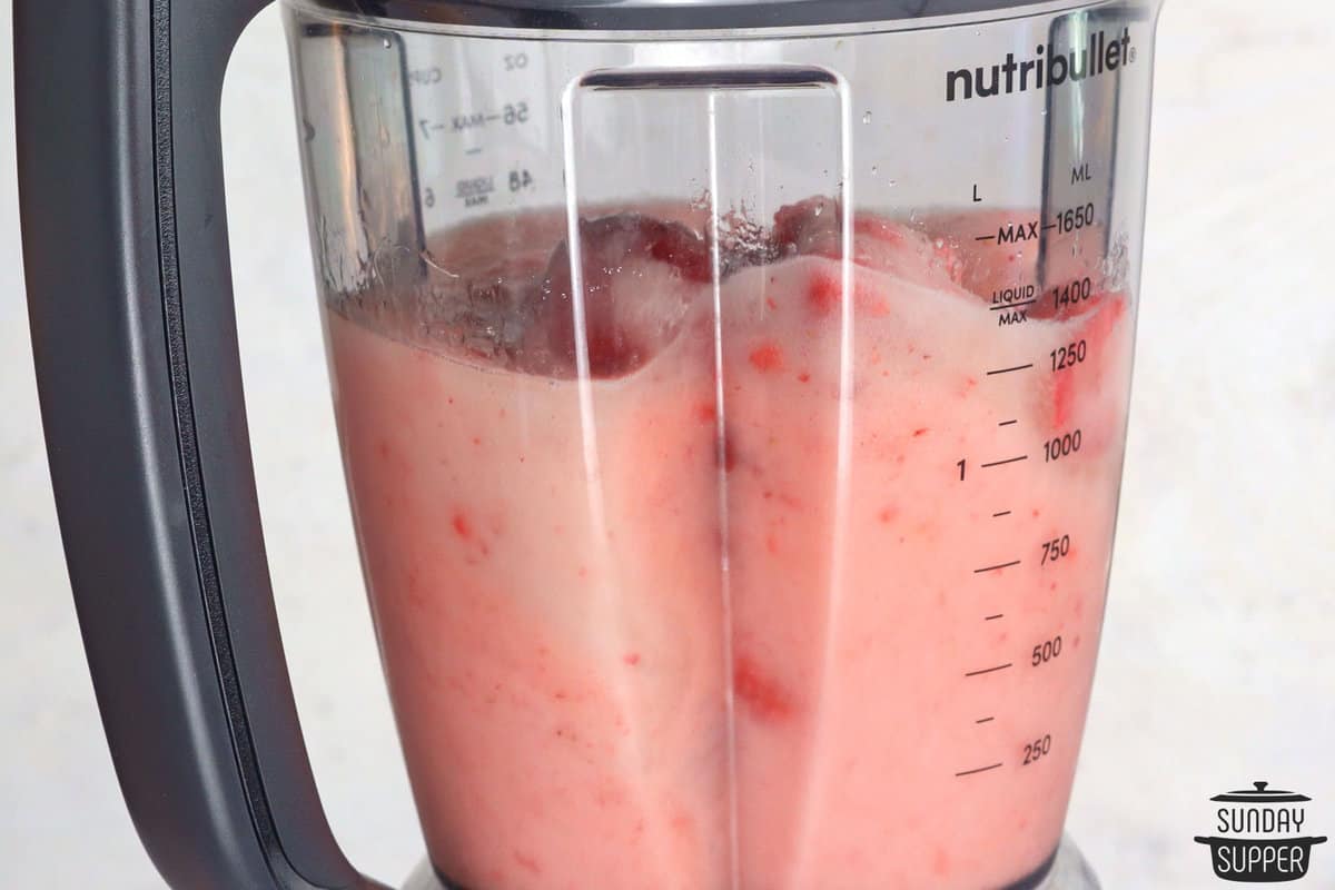 mixing frose in a blender