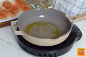 adding olive oil to a pan