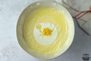 sour cream and lemon zest in cheesecake mixture