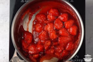 strawberry sauce simmering in a pan