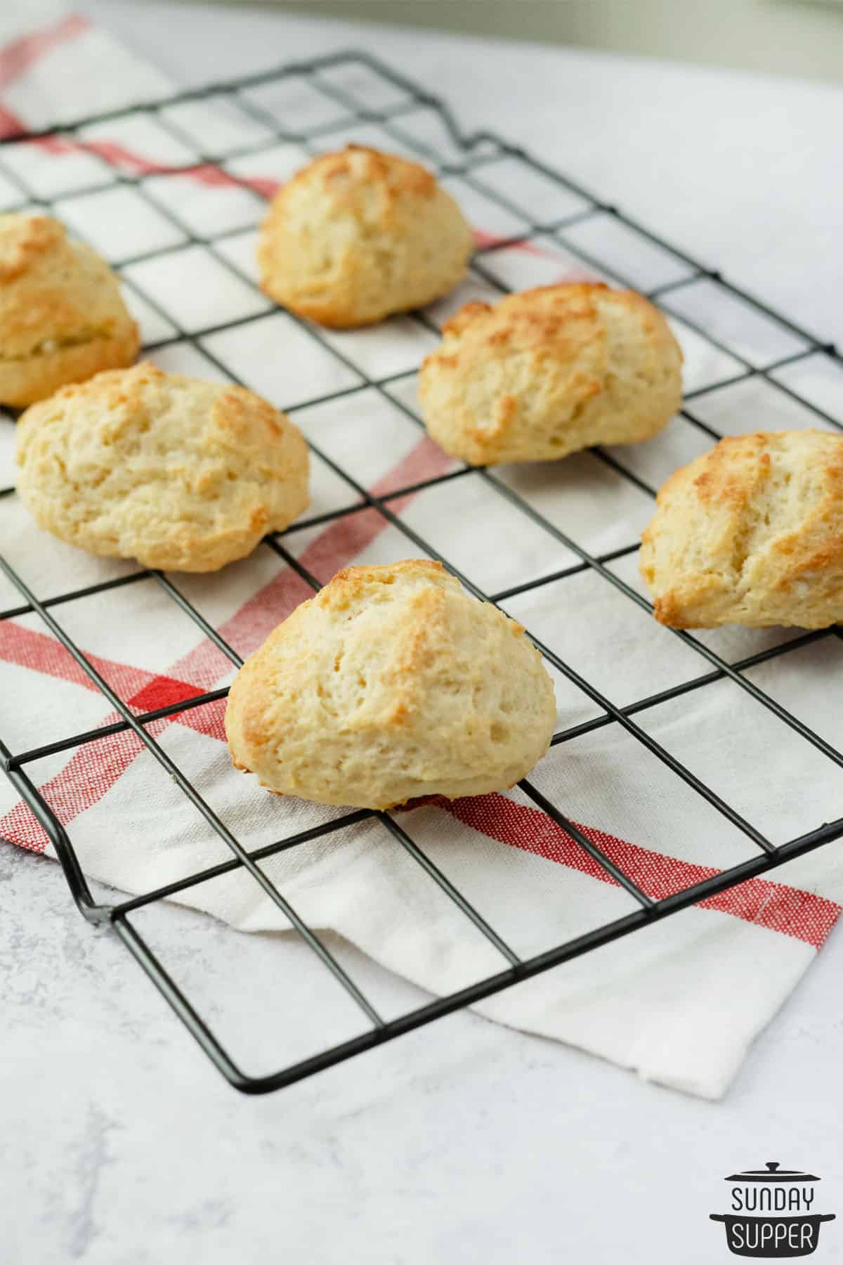 fresh biscuits for strawberry shortcakes on a cooling rack
