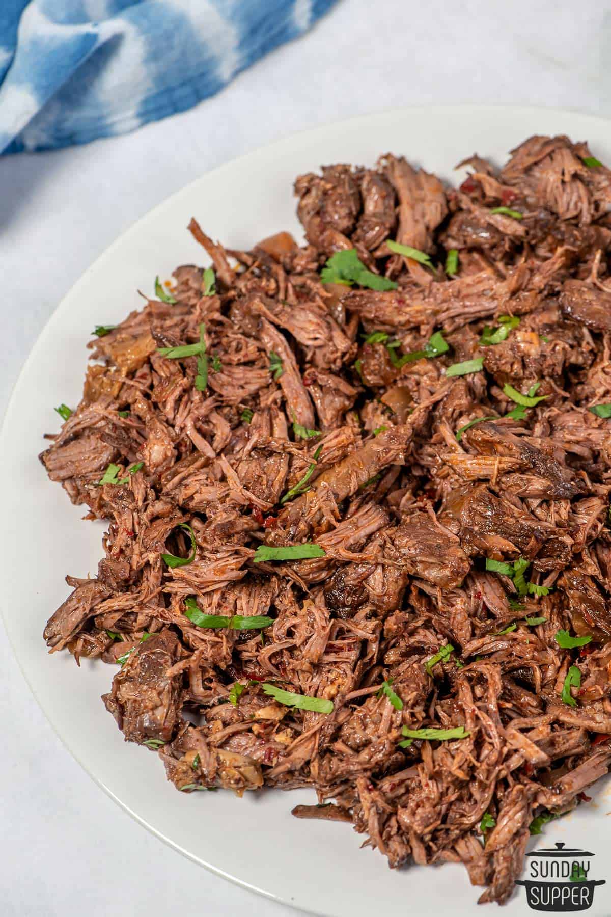 barbacoa on a white serving plate