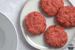 burger patties on a white plate