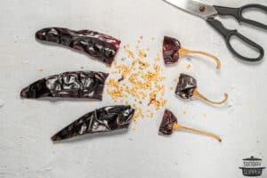 guajillo peppers cut open to show seeds