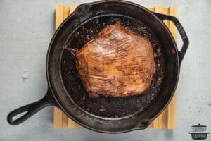 flank steak grilled in a cast iron pan