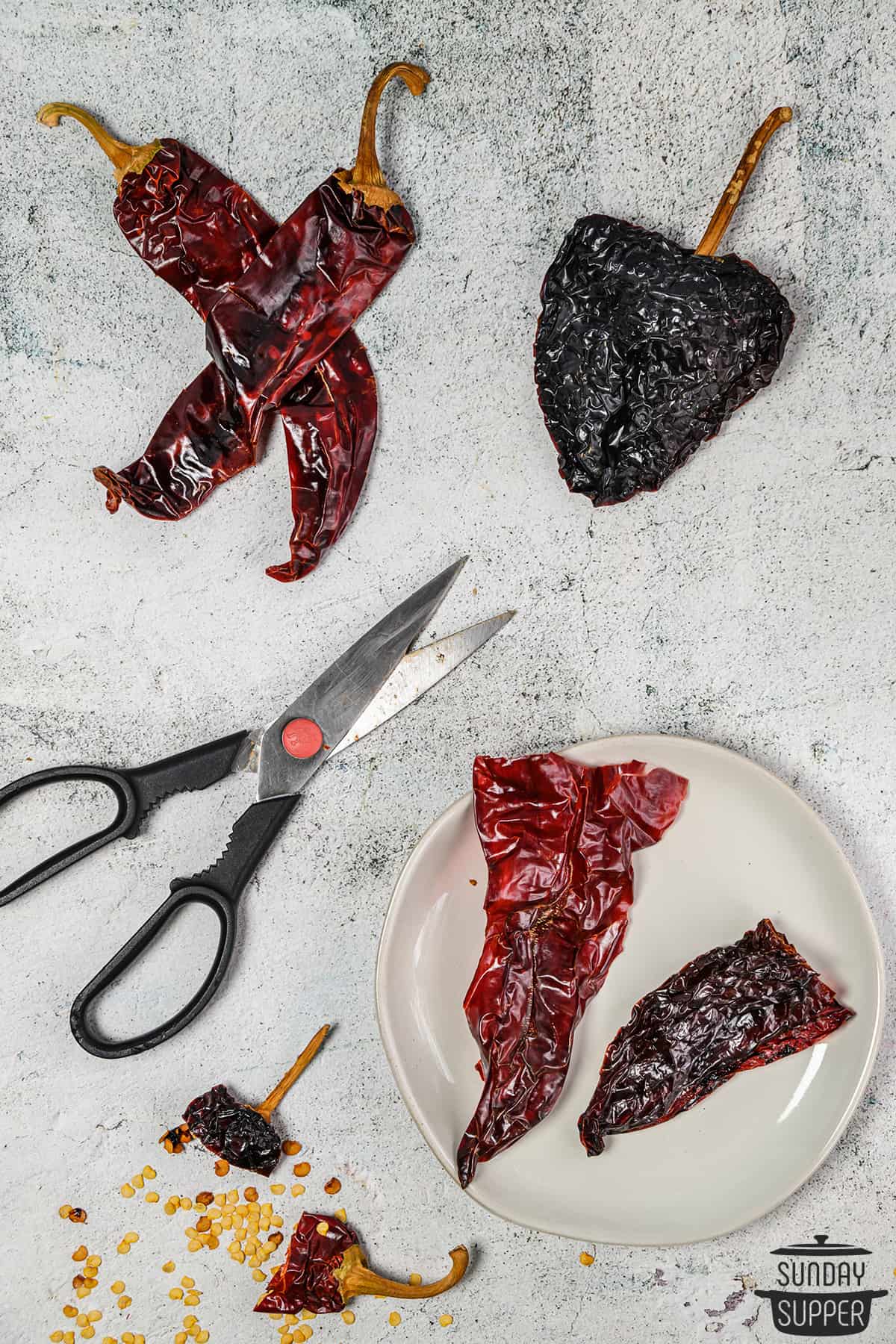 cutting chiles to remove seeds