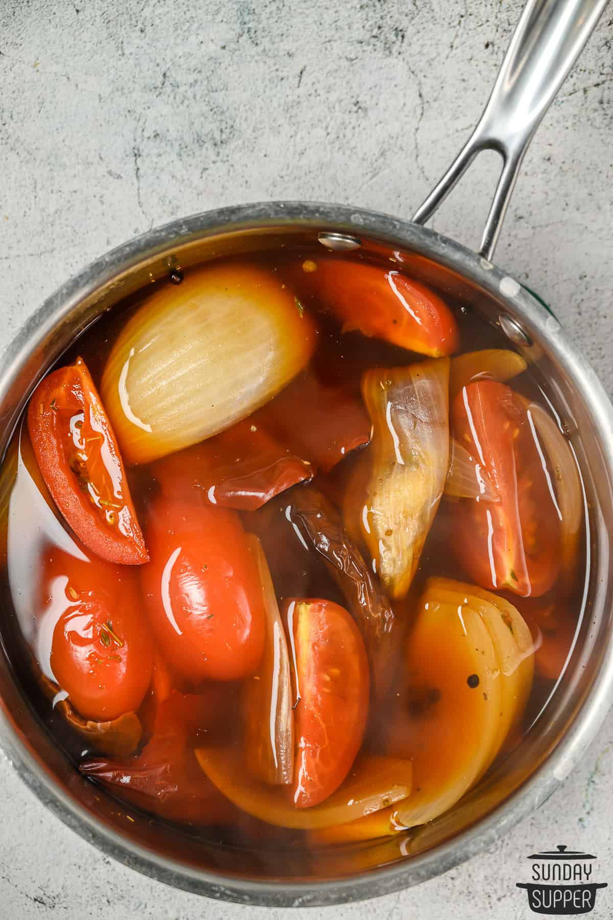 soaking the vegetables and peppers for birria
