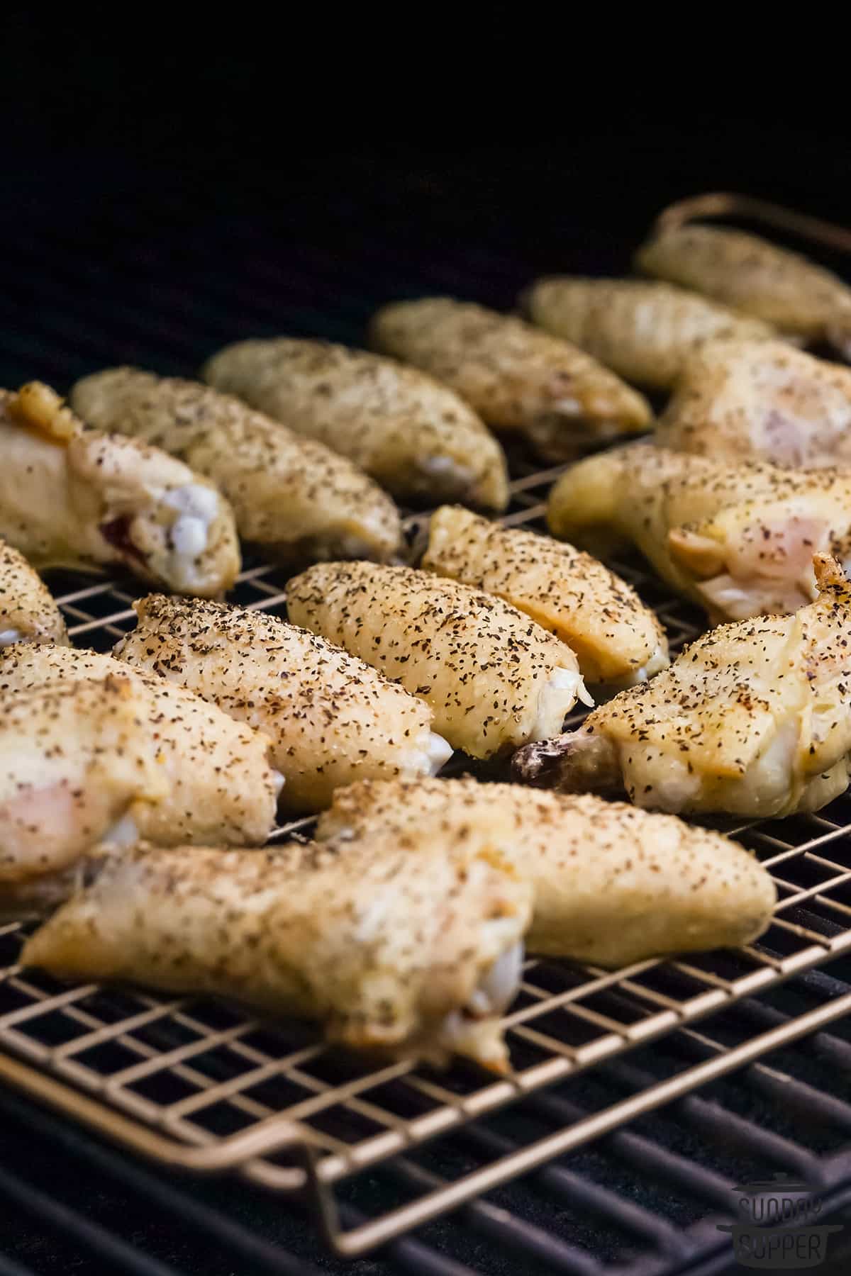 garlic parmesan wings in the smoker