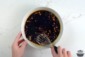 mixing teriyaki sauce in a bowl