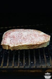 salted wagyu steak in a smoker