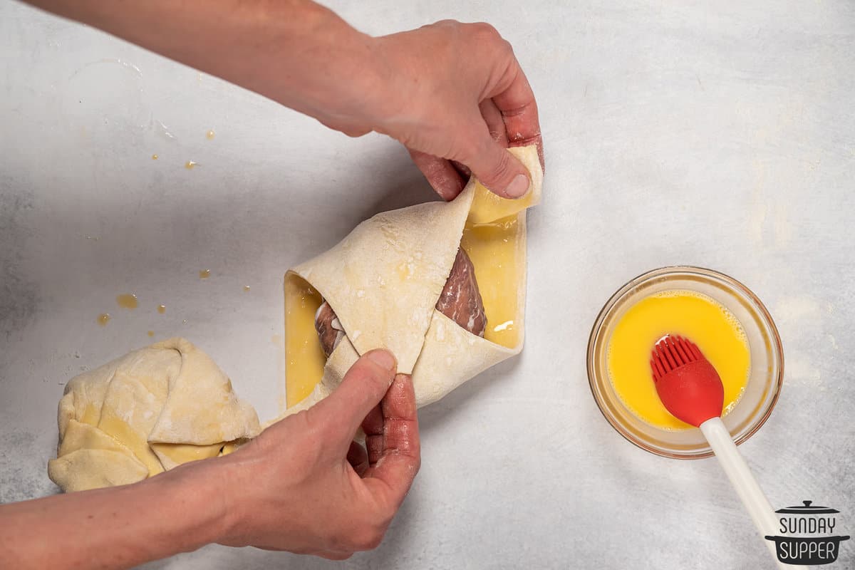 wrapping beef with puff pastry