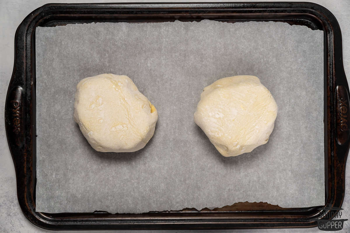 beef wellingtons on a baking sheet ready to bake