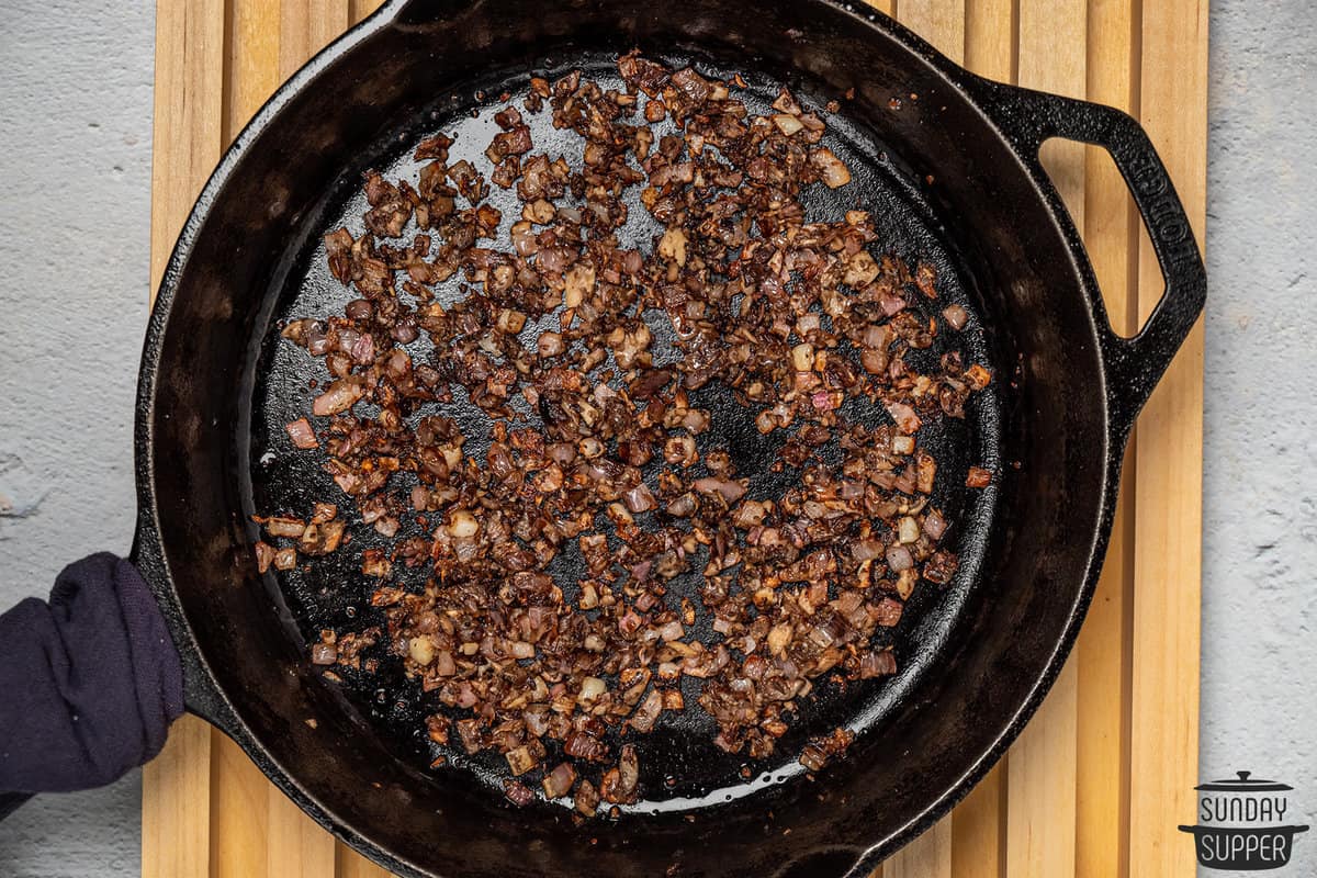 cooked mushrooms and onions in a pan