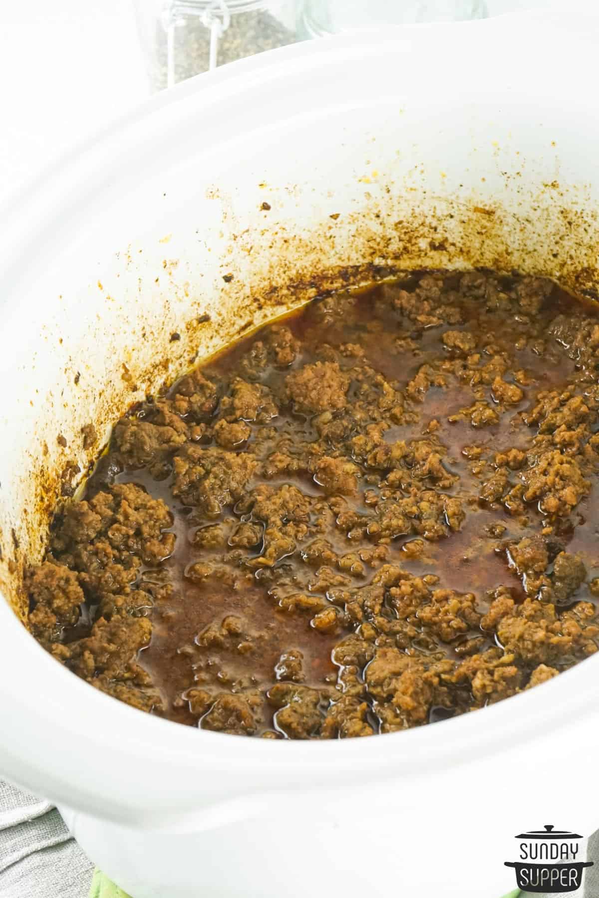 completed taco meat in the pot of a slow cooker
