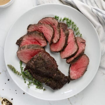 slices of beef tenderloin on a white plate