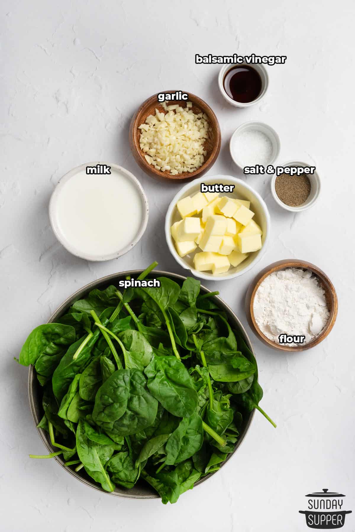 ingredients to make creamed spinach, with labels