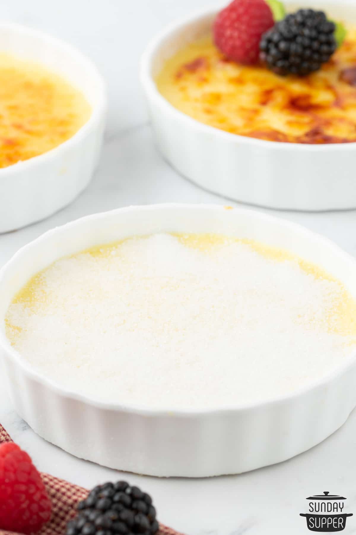fully baked creme brulee after being chilled with sugar added on top
