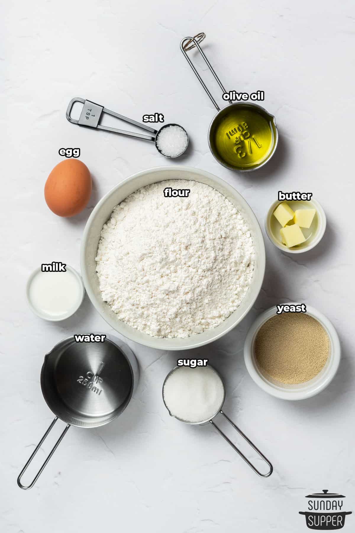 ingredients to make quick dinner rolls, with labels
